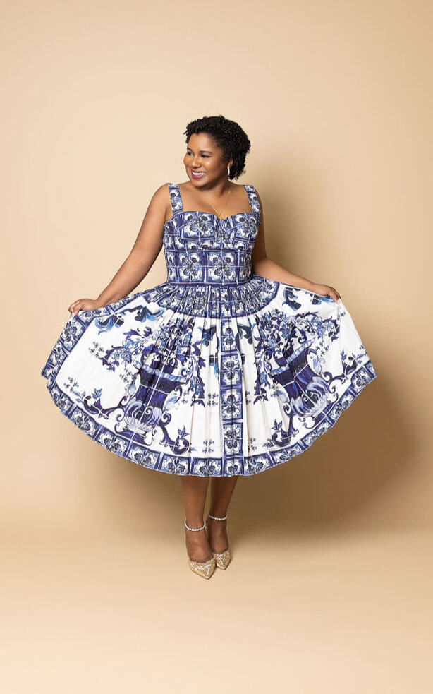 bria-johnson-dolce-gabbana-dress-studio-portrait.jpg Bria Johnson wearing a blue and white Dolce & Gabbana dress with Jimmy Choo heels during a studio portrait session.