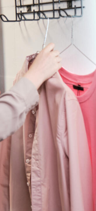 iconically-ready-virtual-embodiment-fitting.jpg Hands adjusting a blush blouse during a Virtual Embodiment Fitting.